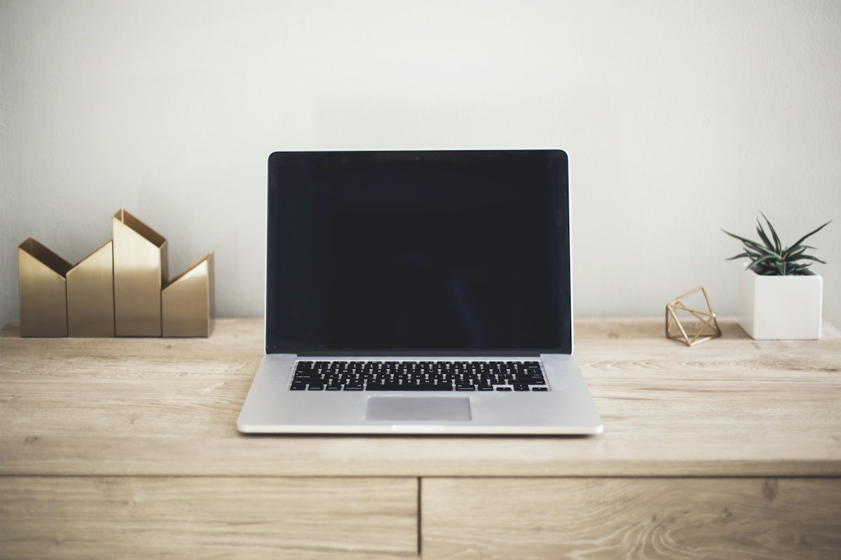 Laptop on a clean desk, representing a focused and accessible digital experience