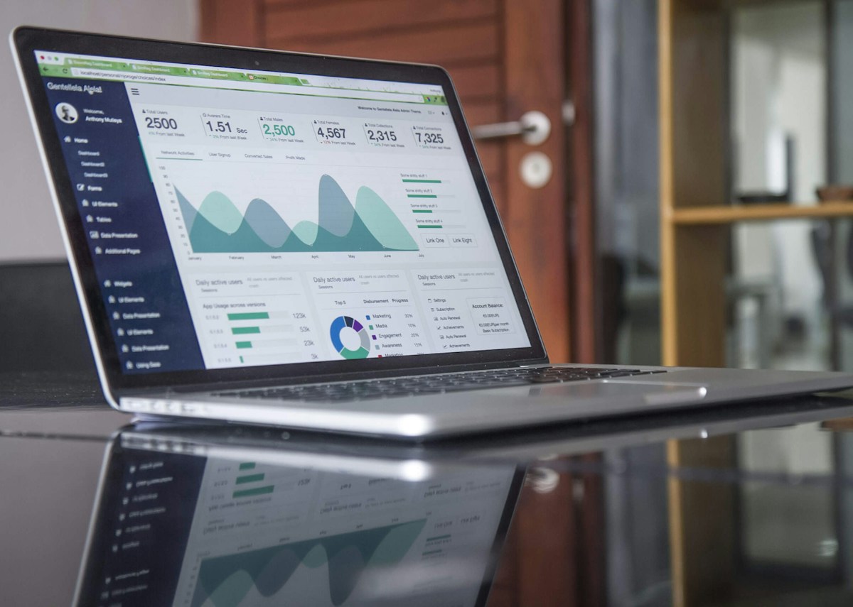 Laptop showing digital reports, representing measurement checkpoints and performance review